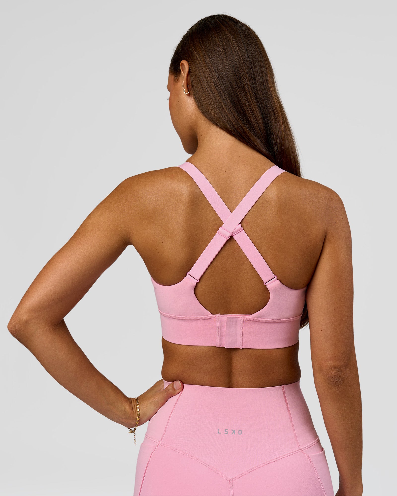 Woman wearing Accelerate Sports Bra - Pink Rose | Model:Brylee | Size:XS