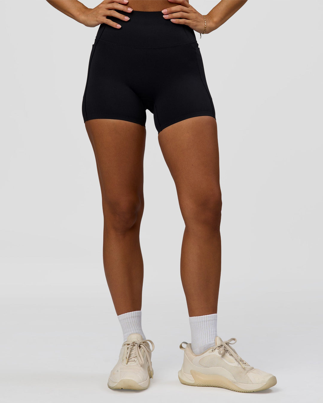 Woman wearing Fusion Bonded High-Rise 4" Short Pockets - Black | Model:Brylee | Size:XS - view 7