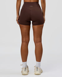 Woman wearing Fusion Bonded High-Rise 4" Short Pockets - Hot Chocolate | Model:Brylee | Size:XS | Thumbnail Index: 2