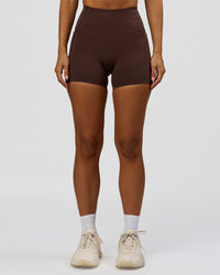 Woman wearing Fusion Bonded High-Rise 4" Short Pockets - Hot Chocolate | Model:Brylee | Size:XS | Thumbnail Index: 4