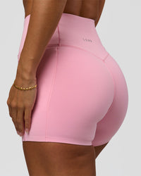 Woman wearing Fusion Bonded High-Rise 4" Short Pockets - Pink Rose | Model:Brylee | Size:XS | Thumbnail Index: 0