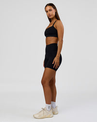 Woman wearing Fusion Bonded High-Rise 6" Short Pockets - Black | Model:Brylee | Size:XS | Thumbnail Index: 10