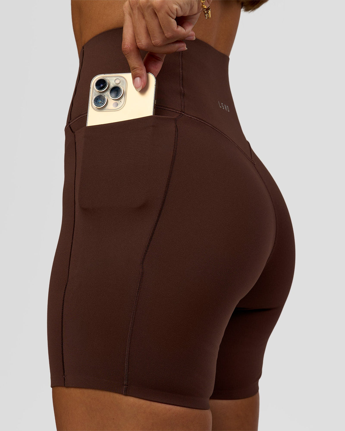 Woman wearing Fusion Bonded High-Rise 6" Short Pockets - Hot Chocolate | Model:Brylee | Size:XS