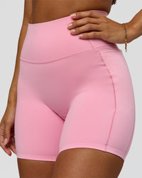 Woman wearing Fusion Bonded High-Rise 6" Short Pockets - Pink Rose | Model:Brylee | Size:XS | Thumbnail Index: 1