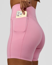Woman wearing Fusion Bonded High-Rise 6" Short Pockets - Pink Rose | Model:Brylee | Size:XS | Thumbnail Index: 2