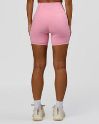 Woman wearing Fusion Bonded High-Rise 6" Short Pockets - Pink Rose | Model:Brylee | Size:XS | Thumbnail Index: 3