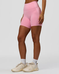 Woman wearing Fusion Bonded High-Rise 6" Short Pockets - Pink Rose | Model:Brylee | Size:XS | Thumbnail Index: 6