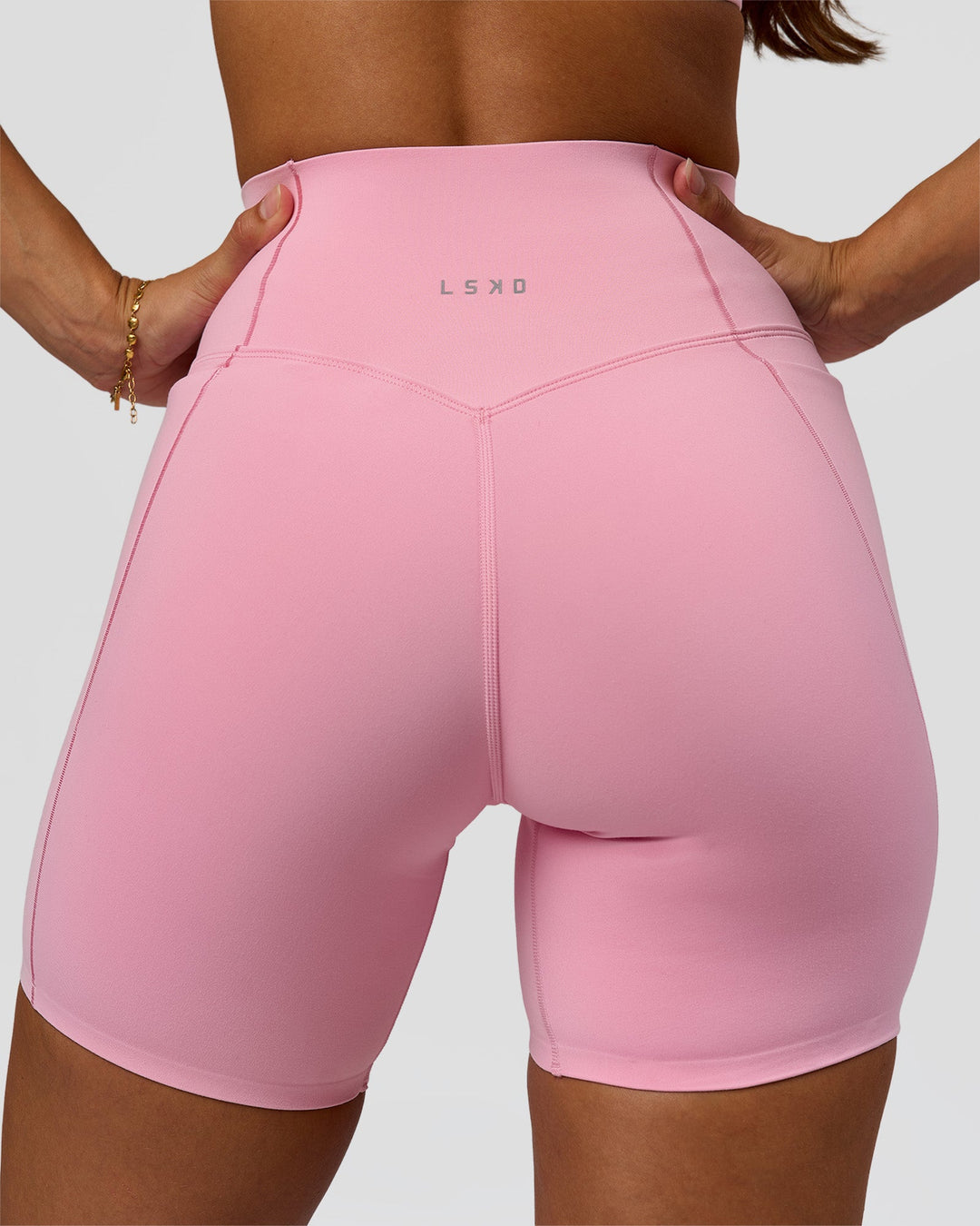 Woman wearing Fusion Bonded High-Rise 6" Short Pockets - Pink Rose | Model:Brylee | Size:XS - view 1