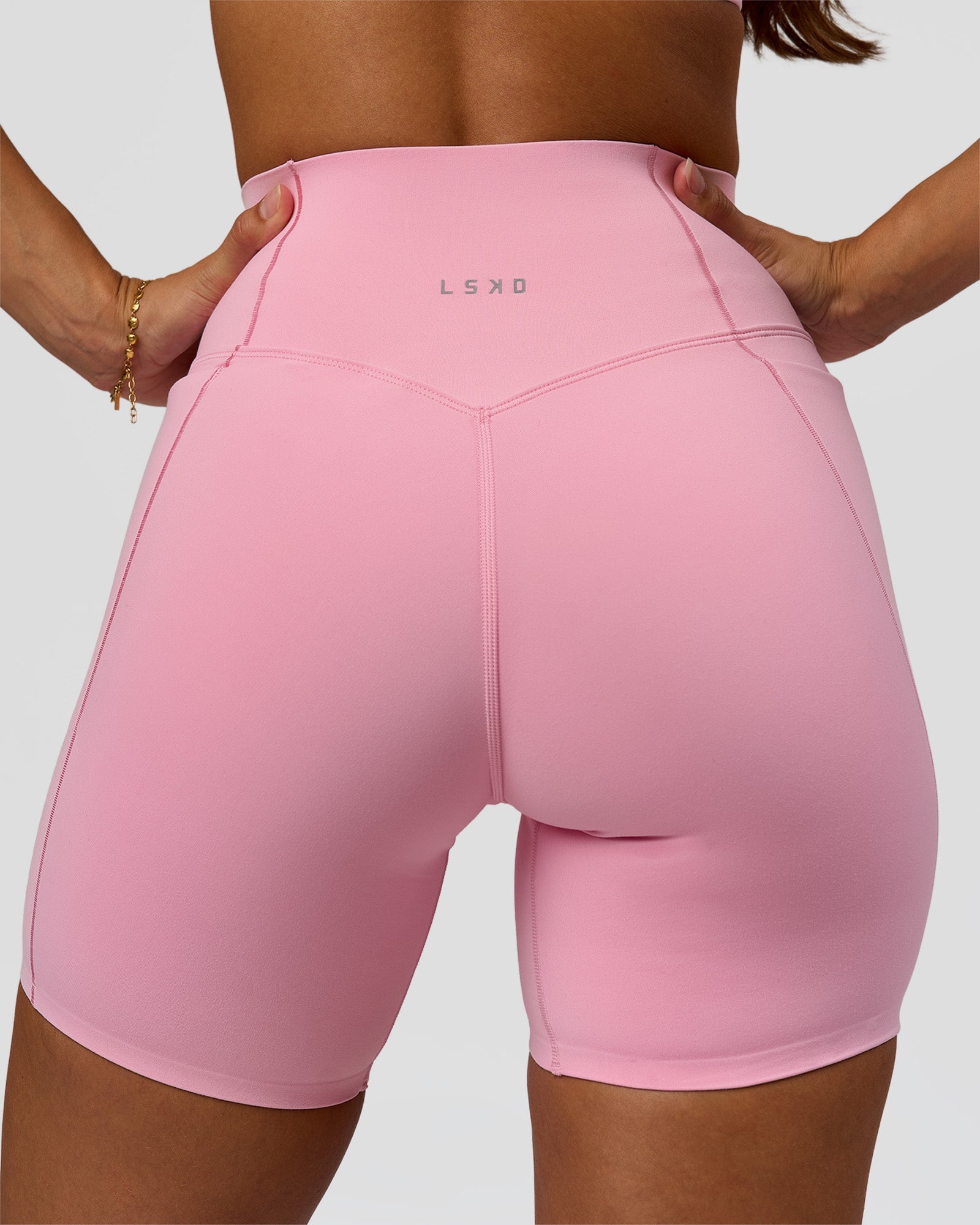 Woman wearing Fusion Bonded High-Rise 6" Short Pockets - Pink Rose | Model:Brylee | Size:XS