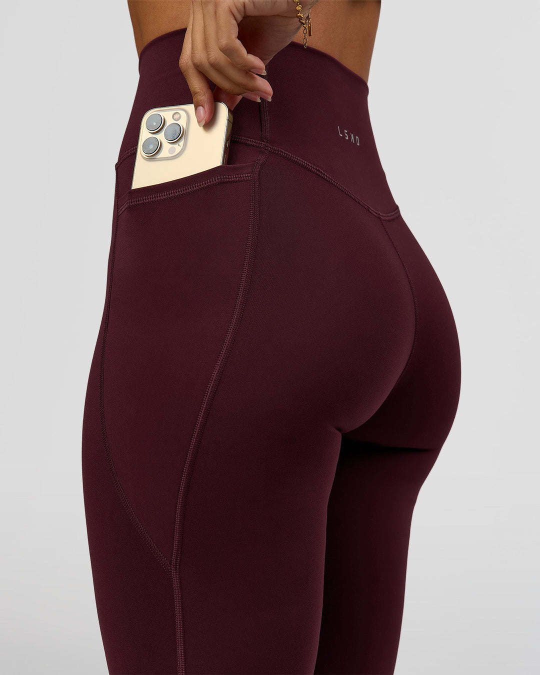 Woman wearing Fusion Ultra High-Rise Full Length Legging Pockets - Cherry Lacquer | Model:Brylee | Size:XS - view 3