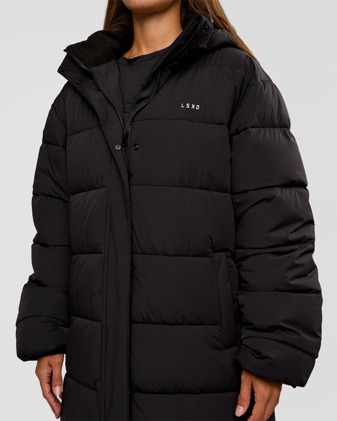 Woman wearing Go-To Puffer Long Jacket - Black | Model:Brylee | Size:XS - view 3