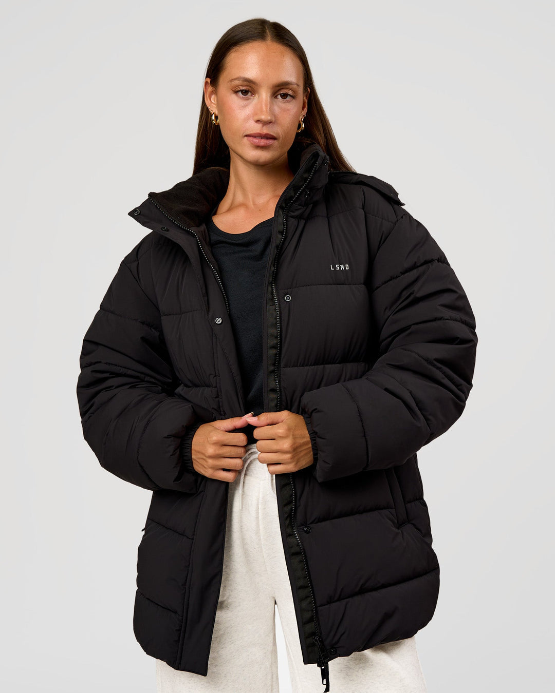 Woman wearing Go-To Puffer Mid Jacket - Black | Model:Brylee | Size:XS - view 1