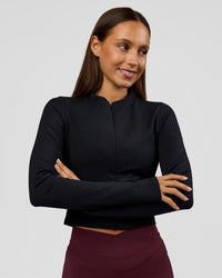 Woman wearing Sculpt Full Zip Long Sleeve Top - Black | Model:Brylee | Size:XS | Thumbnail Index: 2