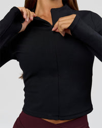 Woman wearing Sculpt Full Zip Long Sleeve Top - Black | Model:Brylee | Size:XS | Thumbnail Index: 3