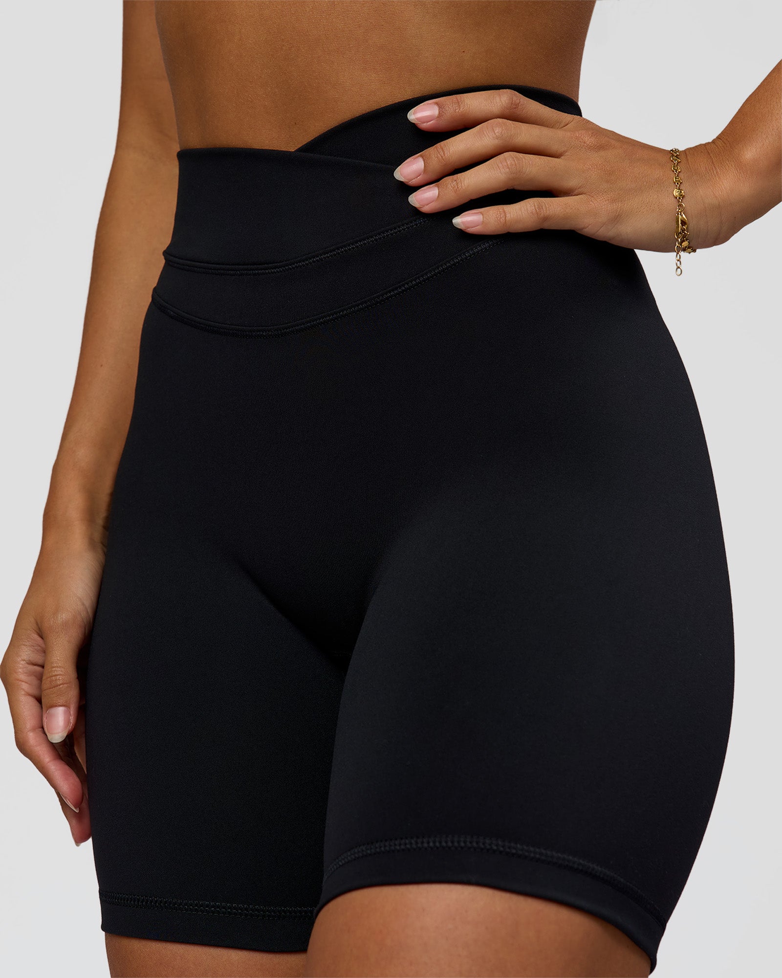 Woman wearing Solstice High-Rise 6" Short - Black | Model:Brylee | Size:XS