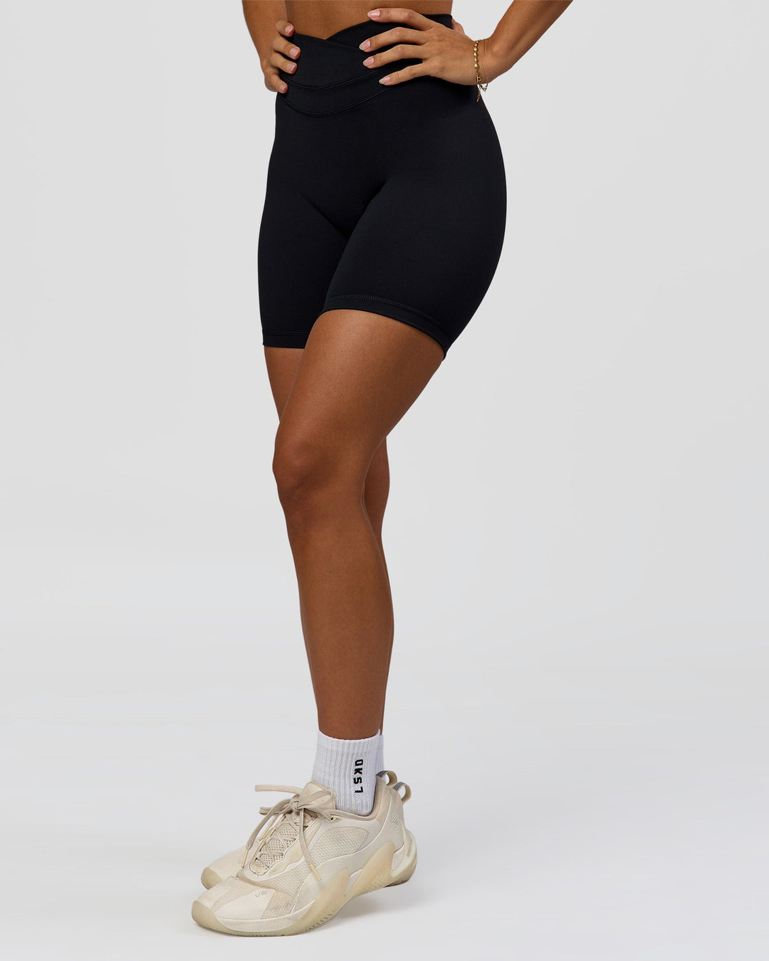 Woman wearing Solstice High-Rise 6" Short - Black | Model:Brylee | Size:XS - view 5