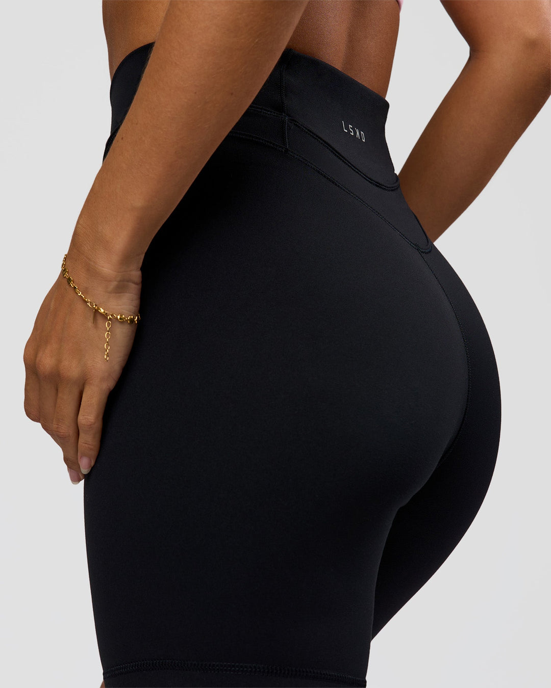 Woman wearing Solstice High-Rise 6" Short - Black | Model:Brylee | Size:XS - view 7