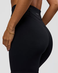Woman wearing Solstice High-Rise 6" Short - Black | Model:Brylee | Size:XS | Thumbnail Index: 6