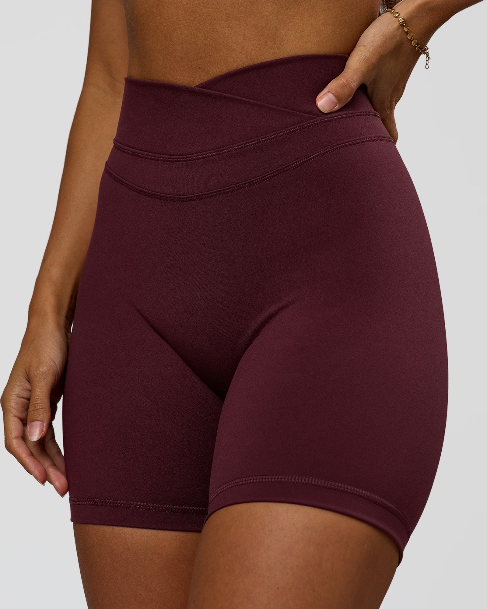 Woman wearing Solstice High-Rise 6" Short - Cherry Lacquer | Model:Brylee | Size:XS