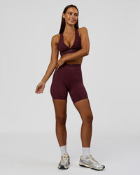 Woman wearing Solstice High-Rise 6" Short - Cherry Lacquer | Model:Brylee | Size:XS | Thumbnail Index: 4