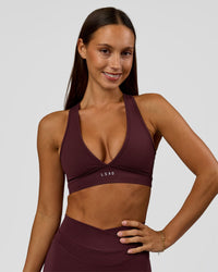 Woman wearing Stamina Sports Bra - Cherry Lacquer | Model:Brylee | Size:XS | Thumbnail Index: 0