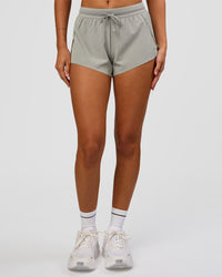 Woman wearing Accelerate 3" Mid-Rise Running Short - Alloy | Model:Charli | Size:XS | Thumbnail Index: 4