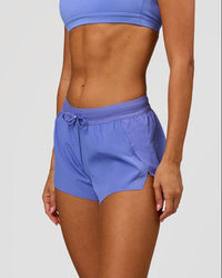 Woman wearing Accelerate 3" Mid-Rise Running Short - Bluebell | Model:Charli | Size:XS | Thumbnail Index: 1