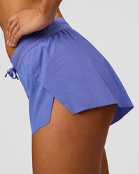 Woman wearing Accelerate 3" Mid-Rise Running Short - Bluebell | Model:Charli | Size:XS | Thumbnail Index: 0