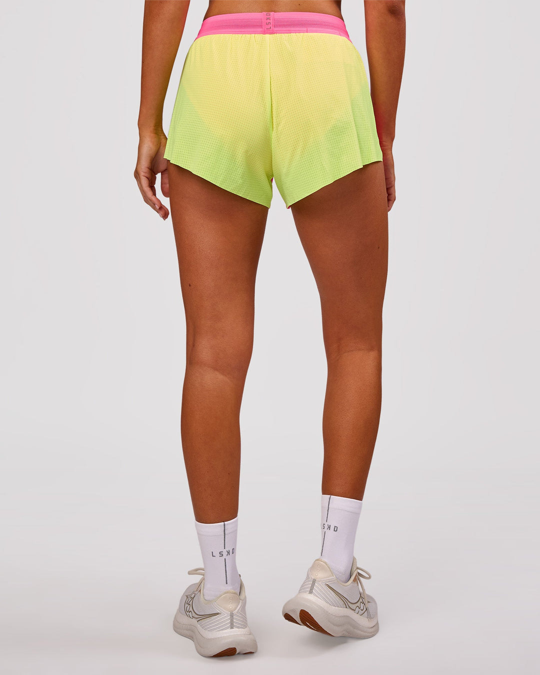 Woman wearing Accelerate 3" Mid-Rise Running Short - Lime Glo-Sugar Plum | Model:Charli | Size:XS - view 6
