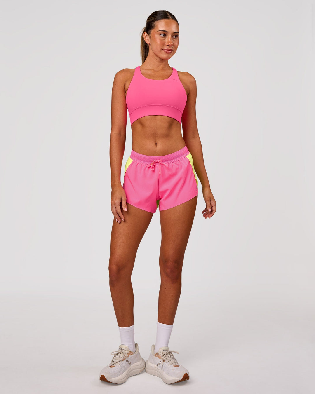 Woman wearing Accelerate 3" Mid-Rise Running Short - Lime Glo-Sugar Plum | Model:Charli | Size:XS - view 3