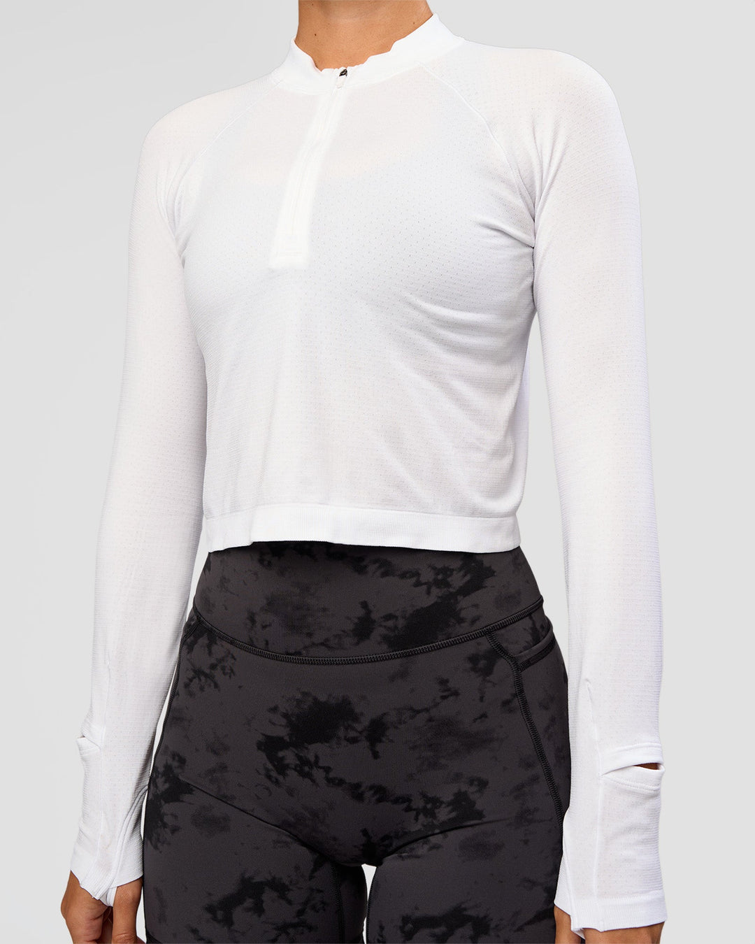 Woman wearing AeroFLX+ Long Sleeve Skimmer Half Zip - White/White | Model:Charli | Size:XS - view 5