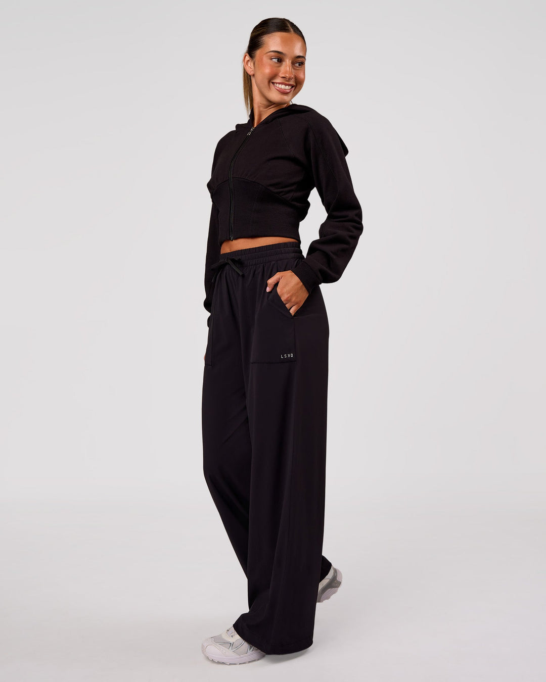 Woman wearing Bend Woven Pant - Black | Model:Charli | Size:XS - view 1