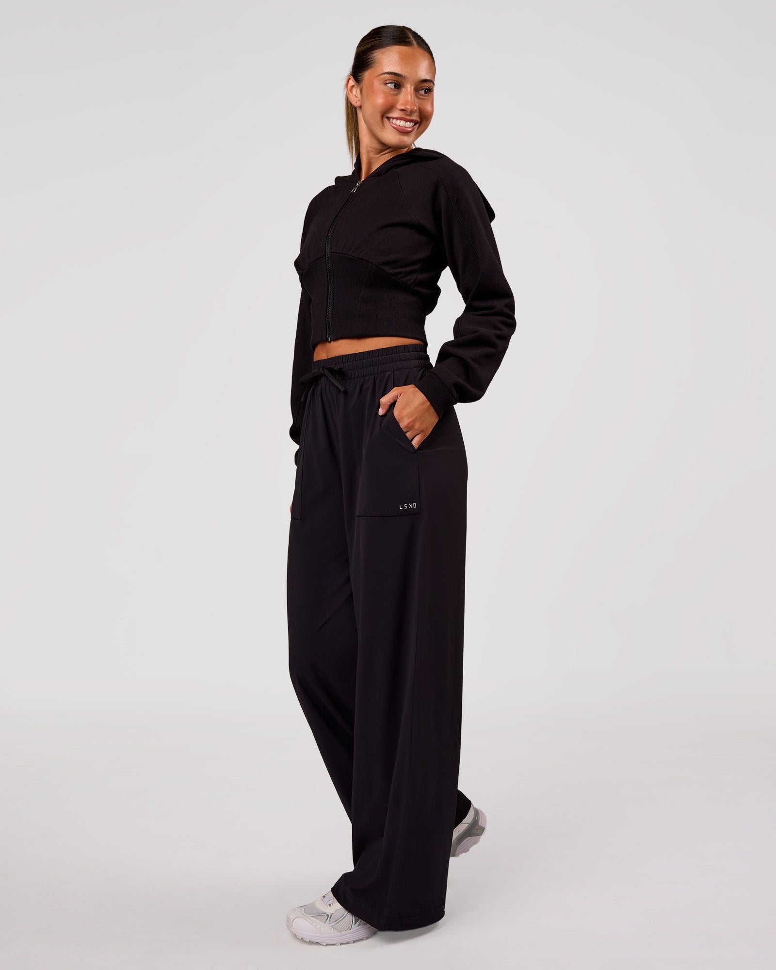 Woman wearing Bend Woven Pant - Black | Model:Charli | Size:XS