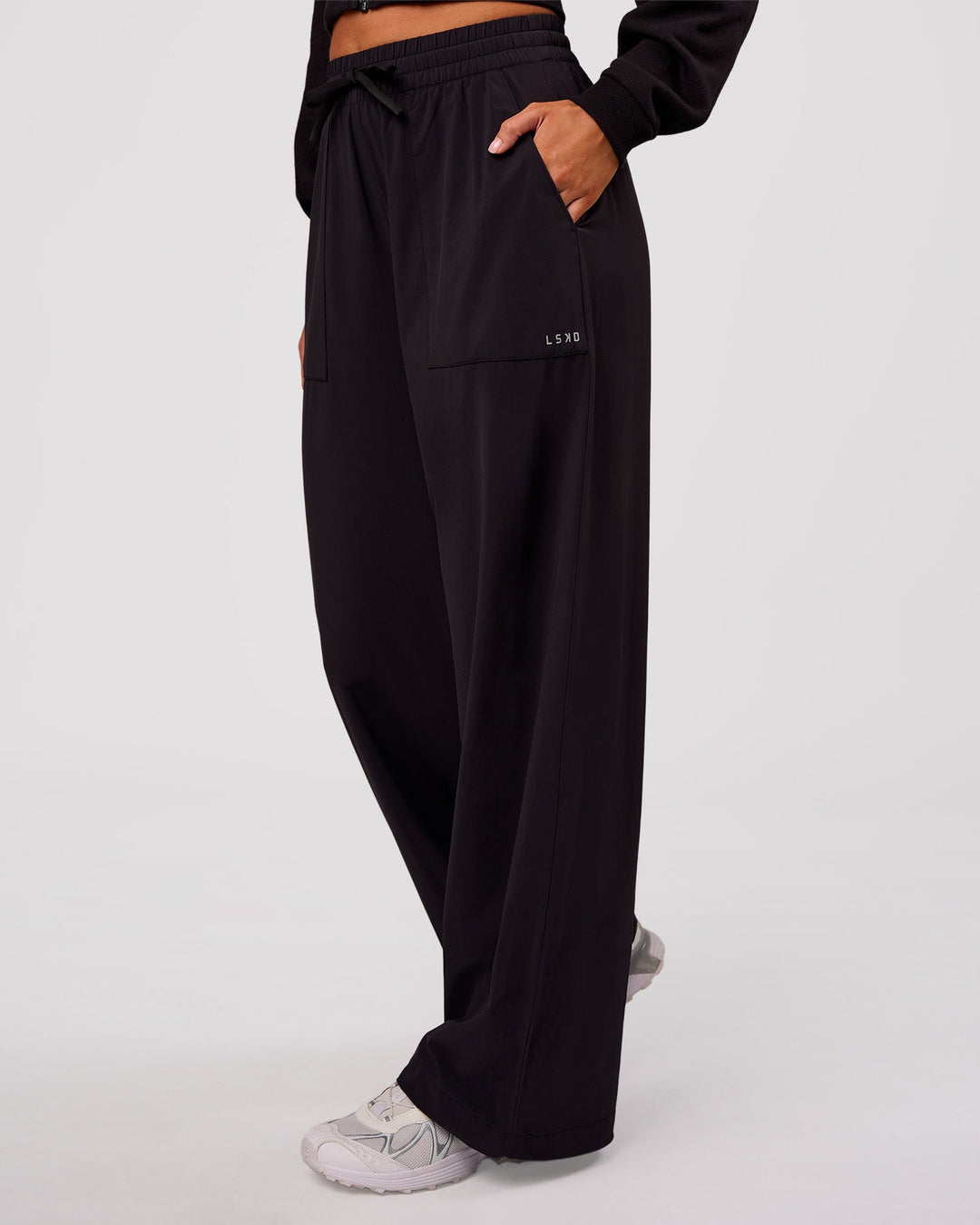 Woman wearing Bend Woven Pant - Black | Model:Charli | Size:XS - view 2