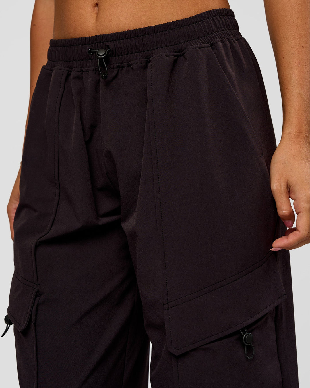 Woman wearing Endeavour Cargo Pant - Black | Model:Charli | Size:XS - view 6