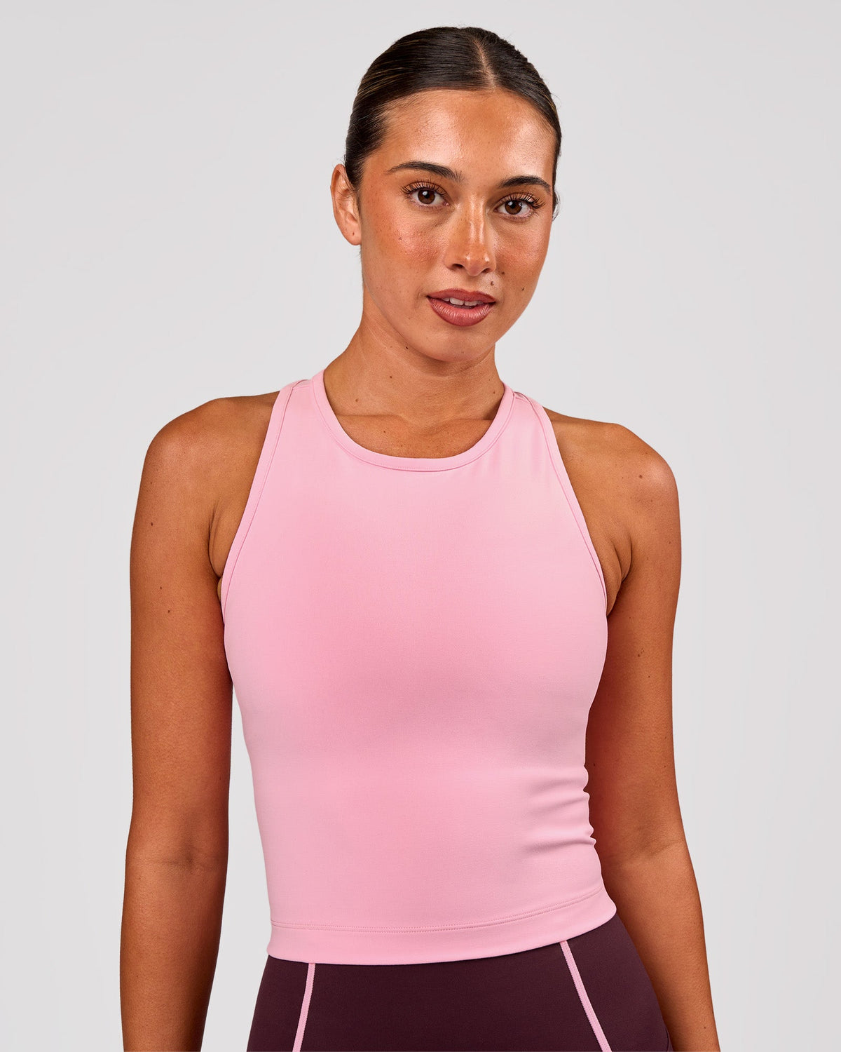 Woman wearing Flow Performance Tank 2.0 - Pink Rose | Model:Charli | Size:XS