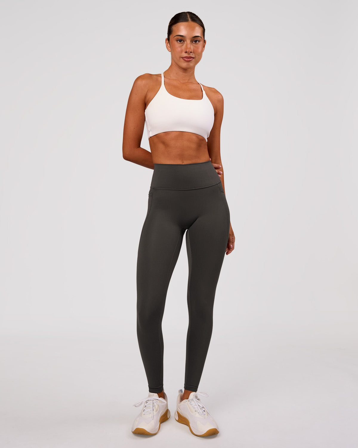 Woman wearing Fusion Ultra High-Rise Full Length Legging Pockets - Onyx | Model:Charli | Size:XS - view 1