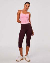 Woman wearing Fusion V Contour Ultra High-Rise 3/4 Legging Pockets - Cherry Lacquer | Model:Charli | Size:XS | Thumbnail Index: 0