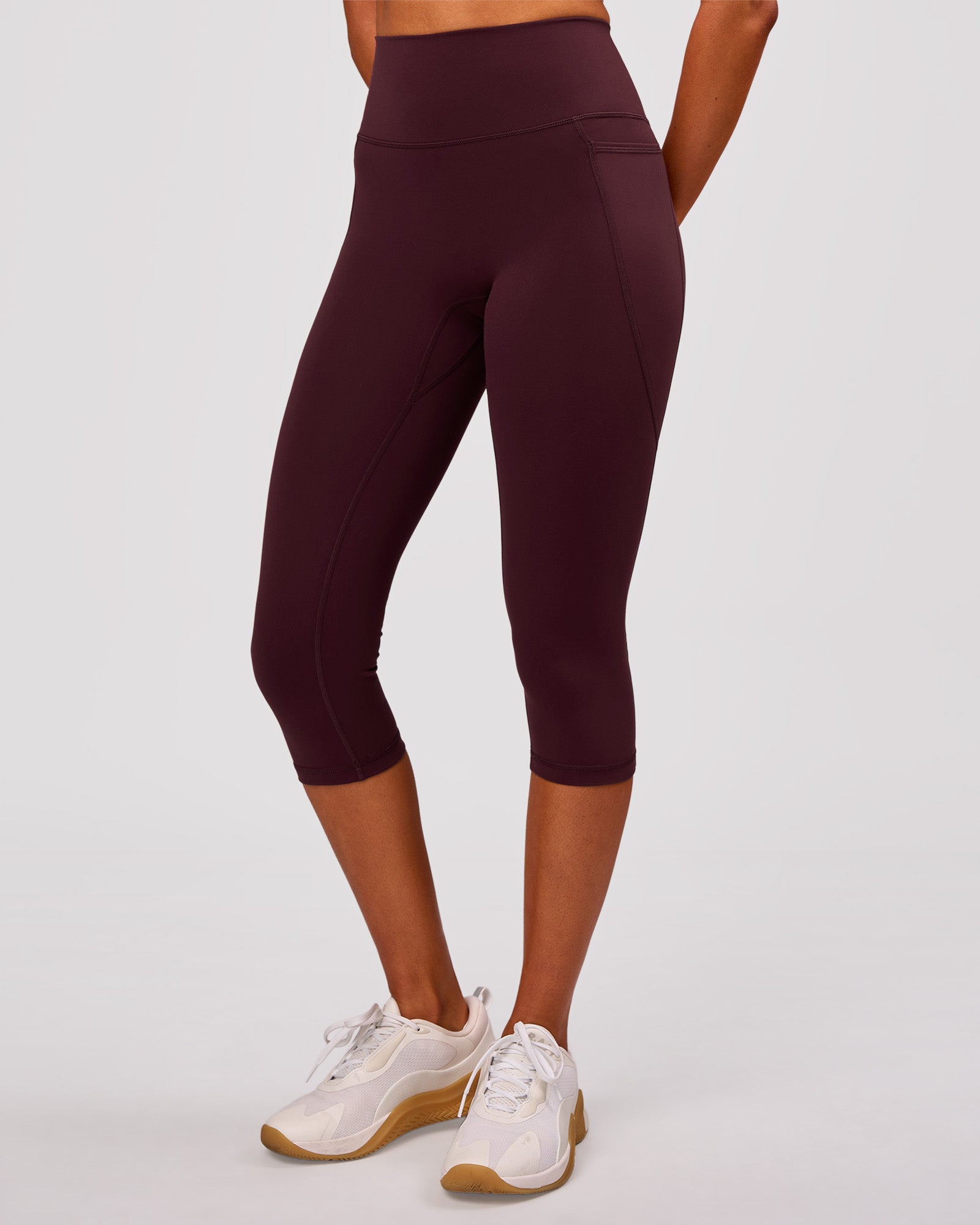 Woman wearing Fusion V Contour Ultra High-Rise 3/4 Legging Pockets - Cherry Lacquer | Model:Charli | Size:XS