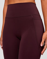 Woman wearing Fusion V Contour Ultra High-Rise 3/4 Legging Pockets - Cherry Lacquer | Model:Charli | Size:XS | Thumbnail Index: 5