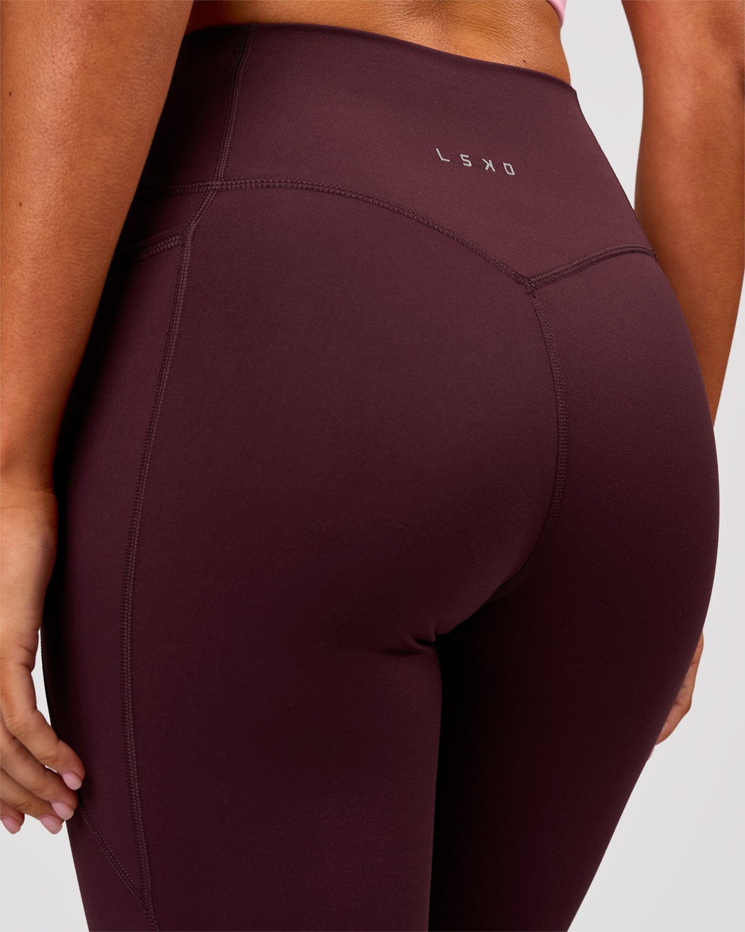 Woman wearing Fusion V Contour Ultra High-Rise 3/4 Legging Pockets - Cherry Lacquer | Model:Charli | Size:XS - view 7