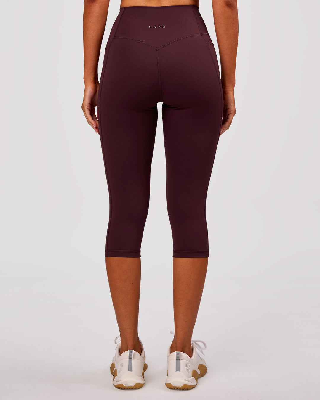 Woman wearing Fusion V Contour Ultra High-Rise 3/4 Legging Pockets - Cherry Lacquer | Model:Charli | Size:XS - view 8