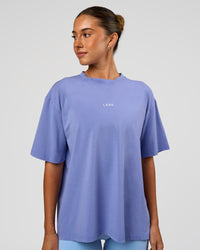 Woman wearing Go-To FLXCotton Oversized Tee - Bluebell Washed-White | Model:Charli | Size:XS | Thumbnail Index: 0