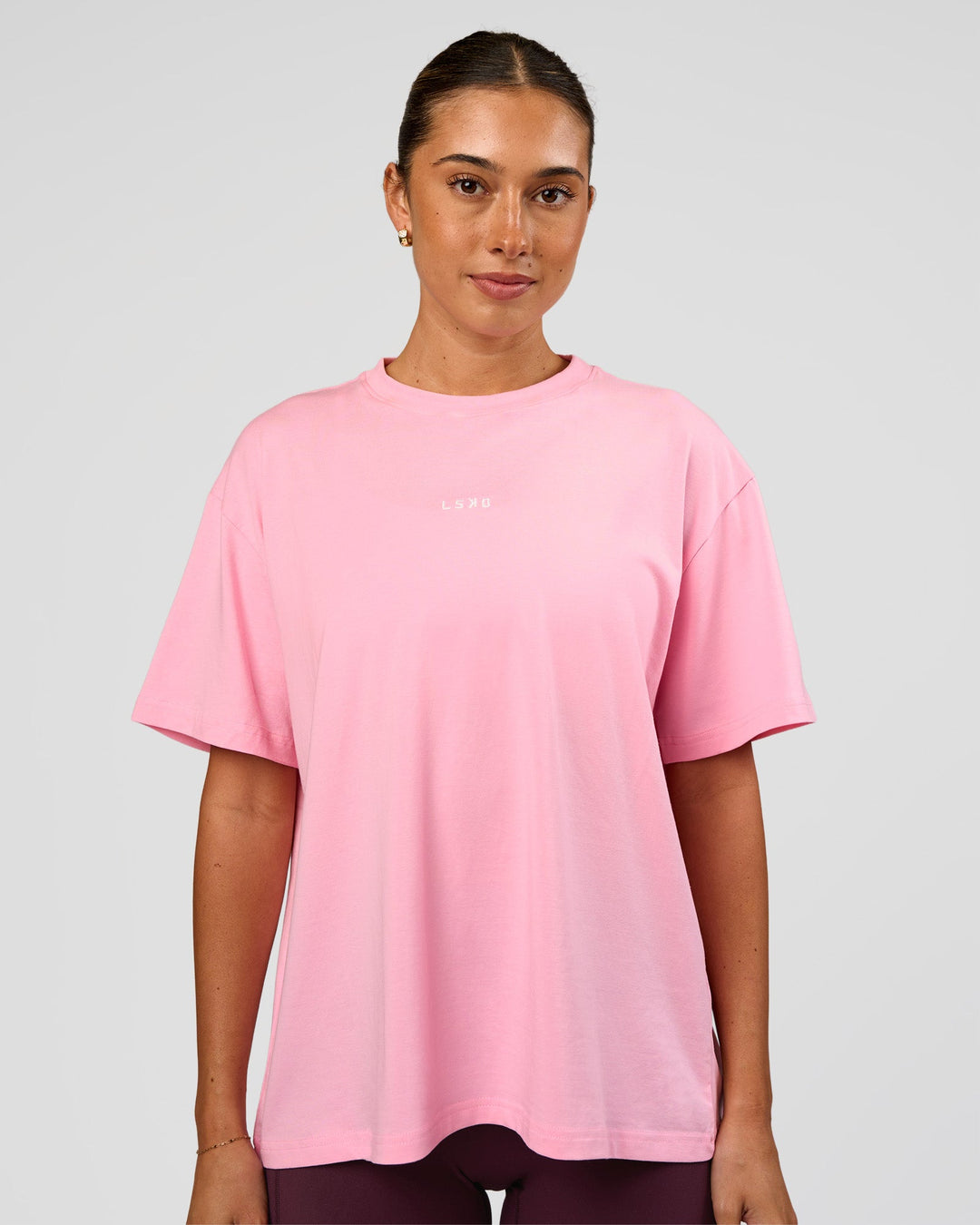 Woman wearing Go-To FLXCotton Oversized Tee - Pink Rose-White | Model:Charli | Size:XS - view 1