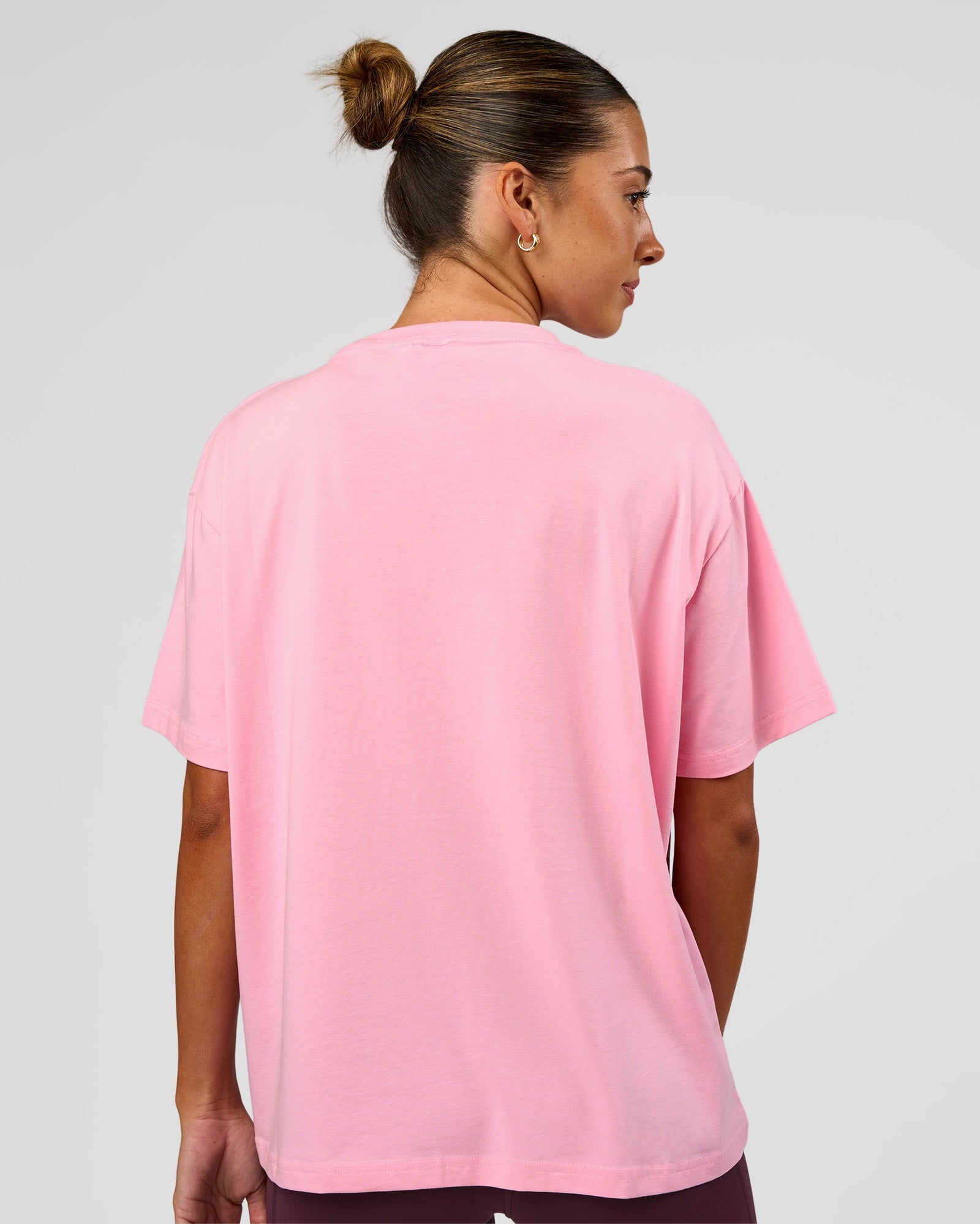 Woman wearing Go-To FLXCotton Oversized Tee - Pink Rose-White | Model:Charli | Size:XS