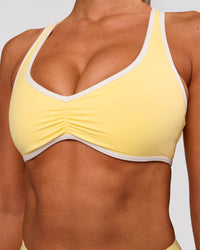 Woman wearing Luminous Sports Bra - Lemon-White | Model:Charli | Size:XS | Thumbnail Index: 2