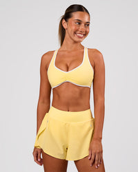 Woman wearing Luminous Sports Bra - Lemon-White | Model:Charli | Size:XS | Thumbnail Index: 5