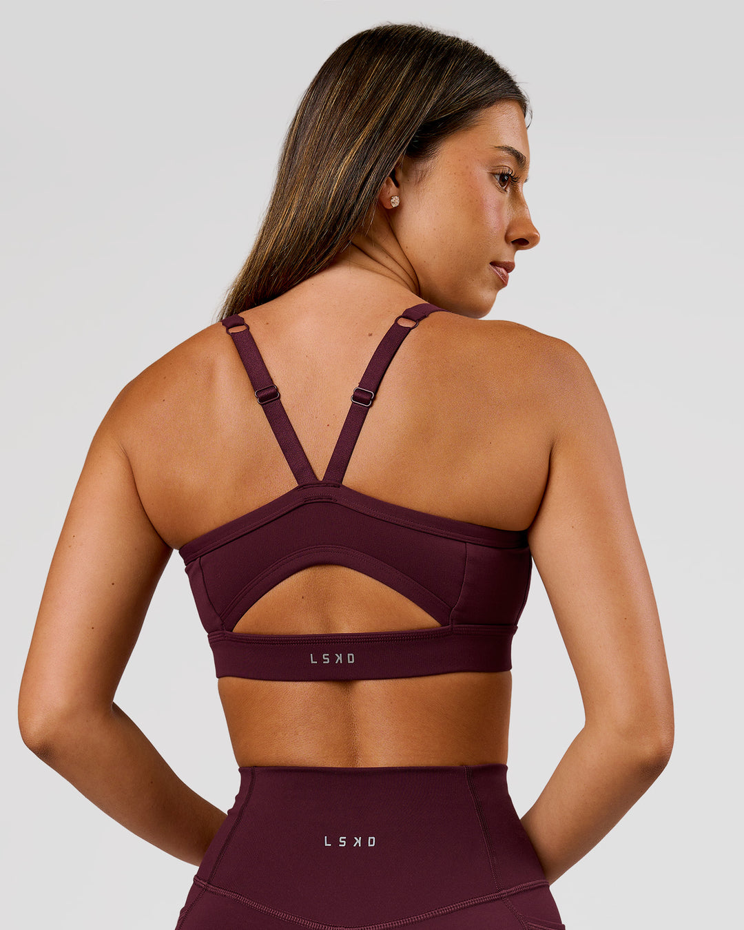 Woman wearing Momentum Sports Bra D/DD/E - Cherry Lacquer | Model:Charli | Size:XS - view 2