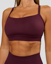 Woman wearing Momentum Sports Bra D/DD/E - Cherry Lacquer | Model:Charli | Size:XS | Thumbnail Index: 2