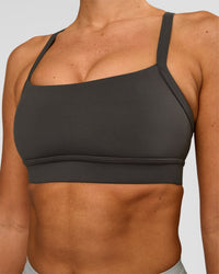 Woman wearing Momentum Sports Bra - Onyx | Model:Charli | Size:XS | Thumbnail Index: 3